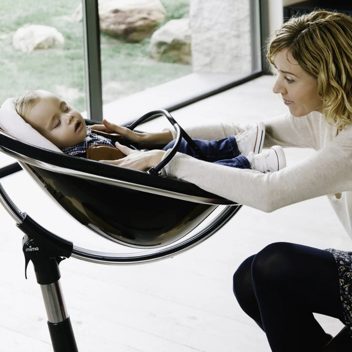 MIMA MOON BLACK HIGH CHAIR WITH WHITE SEAT PAD.
