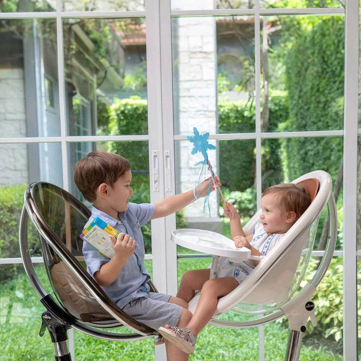 MIMA MOON WHITE HIGH CHAIR WITH BLACK SEAT PAD.